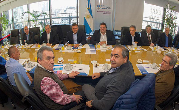 Schmid, Daer y Acuña con el ministro Triaca